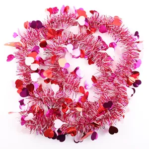 Close-up detail view of the shiny pink heart tinsel garland for romantic party decoration.