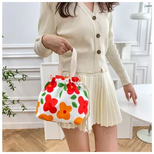Cute floral canvas drawstring lunch bag for women and students, stylish bento tote pouch.