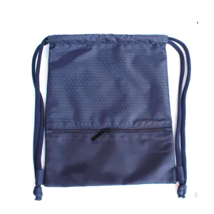 Blue nylon drawstring backpack gym sports cinch bag with zipper pocket and hexagonal texture.