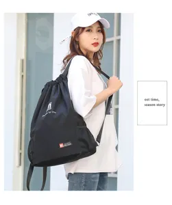 Black drawstring backpack large capacity sports gym bag lightweight travel rucksack for daily use.