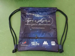 Space theme drawstring backpack with rocket print, lightweight sports gym sack for hiking.