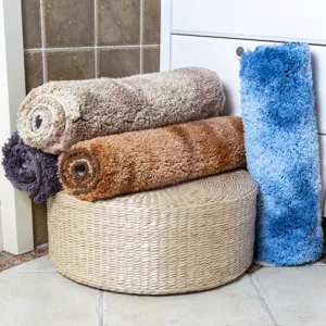 Detailed showcase of thickened shaggy cake velvet bathroom anti-slip floor mats rolled.