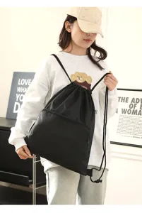 Black drawstring backpack lightweight waterproof sports gym bag casual travel rucksack.