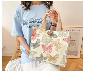 Japanese style canvas tote bag featuring vintage colorful butterfly print and sturdy handles.