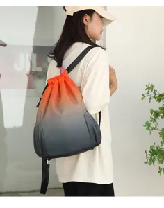 Gradient drawstring backpack detail, waterproof nylon fabric, casual sports travel bag for daily use.