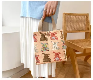 Canvas lunch bag with cute animal print, casual portable tote for daily office use.