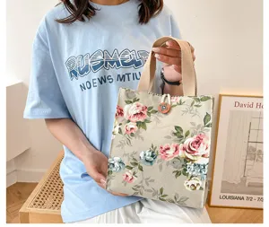 Retro floral canvas tote bag with sturdy handles, perfect for daily lunch and casual outdoor use.