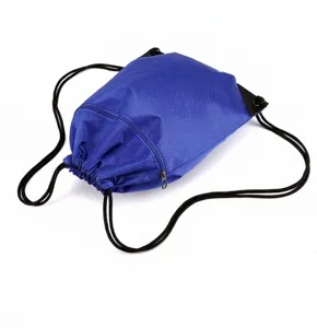 Blue drawstring backpack detail showing diagonal zipper pocket and durable black cord straps.
