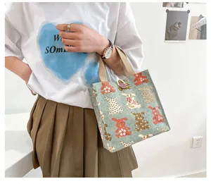 Canvas lunch bag with cute animal print, durable handbag for daily commuting, casual tote.