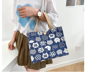 Cute canvas lunch bag with cat pattern, large capacity bento handbag for office and daily use.