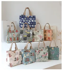Canvas tote lunch bag with cute cat and flower prints, stylish handbag for daily use and work.
