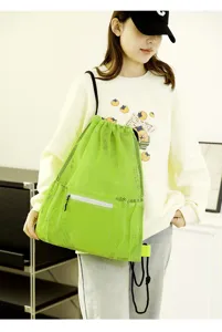 Neon green mesh drawstring backpack, breathable sports beach bag with front zipper pocket.