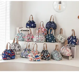 Waterproof canvas lunch bag with cute animal prints, portable drawstring bento pouch for daily use.