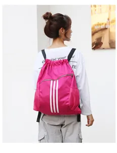 Pink drawstring sports backpack with three stripes, large capacity gym bag for men and women.