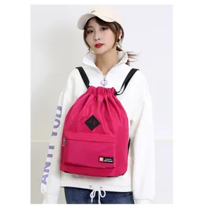 Stylish pink drawstring backpack for women, lightweight waterproof casual daypack for travel.