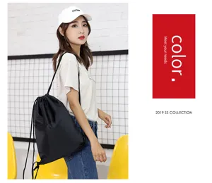 Black drawstring backpack lightweight fabric casual daypack for daily school gym use.