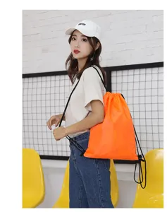 Bright orange 210D polyester drawstring backpack for travel, sports, and casual daily use.