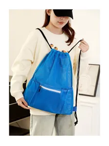 Detail view of blue mesh drawstring backpack, perfect for gym, sports and beach use.
