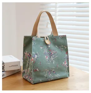 Floral canvas lunch bag for office workers, cute portable bento tote with sturdy handle.