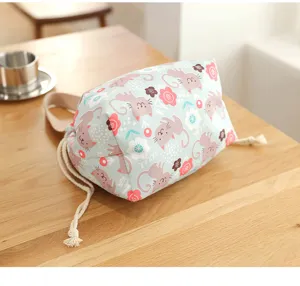 Close-up view of the cute cat print and soft cotton drawstring on the bag surface.