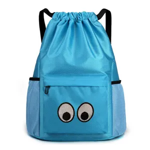 Blue drawstring backpack with cute embroidered eyes, front zipper pocket and mesh side pockets.