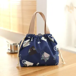 Japanese style waterproof canvas lunch bag with cute cat print and drawstring closure.
