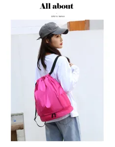 Pink drawstring gym backpack detail, featuring bottom wet dry compartment and mesh side pockets.