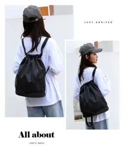 Waterproof black drawstring gym backpack with shoe compartment for sports travel swim fitness.