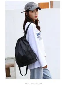 Waterproof black drawstring sports backpack for swimming and fitness with dry wet separation.
