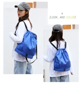 Blue waterproof drawstring backpack with wet dry compartment sports gym bag for women and girls.