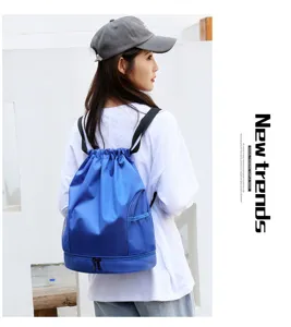 Detailed view of the blue waterproof drawstring sports backpack with bottom shoe compartment.