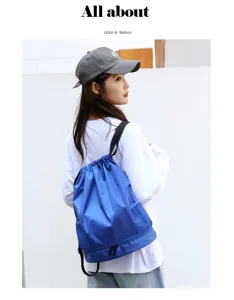 Detailed view of waterproof blue drawstring swim backpack with wet dry compartment and side mesh pockets.