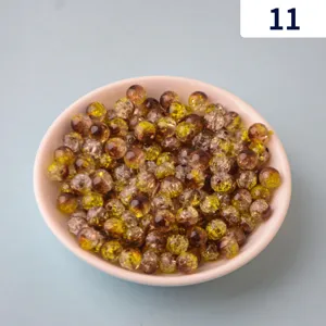 Detailed close-up shot of acrylic crackle double-color beads for DIY jewelry making parts.