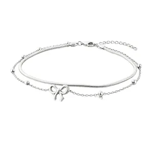Elegant double-layered stainless steel anklet featuring a bow charm and silver beads