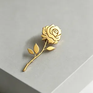 Close-up of a gold-plated stainless steel rose brooch with intricate petal details