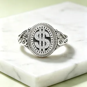 Detailed close-up of a vintage dollar sign ring featuring sparkling stone inlay and rope border