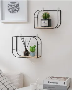 Minimalist black metal wall shelves with wooden base in a cozy living room decor