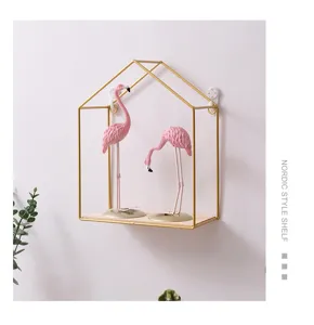 Nordic house-shaped gold metal wall shelf with wooden base and decor