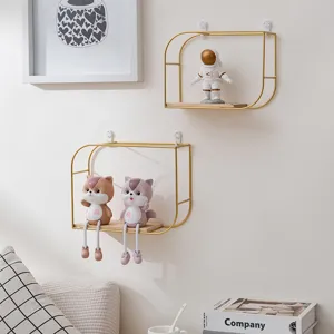 European style minimalist gold metal and wood wall shelves in a cozy living room decor.