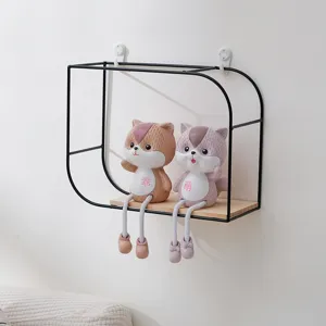 Minimalist wall-mounted shelf with black metal frame and wooden base for home decor