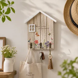 Decorative wooden house-shaped key holder for wall with three hooks for home entryway