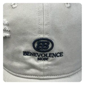 Distressed beige baseball cap with front embroidery and casual streetwear style for daily wear.