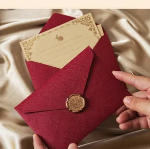 Red linen textured envelope set with vintage wax seal stamp and cute letter card for gifts.