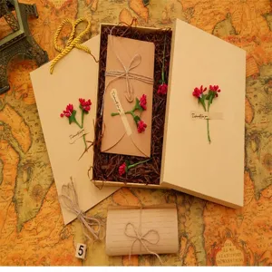 Vintage letter paper and envelope gift box set with retro kraft design and knitted flowers.
