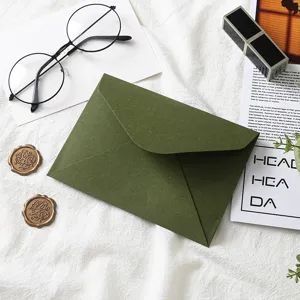 Dark green envelope and wax seal set detail view, retro style stationery for greeting cards.