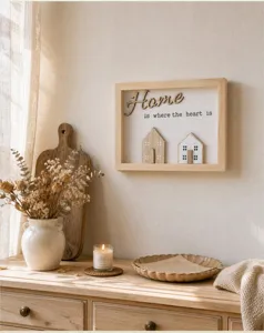 Elegant wooden shadow box frame featuring Home is where the heart is 3D wall decor