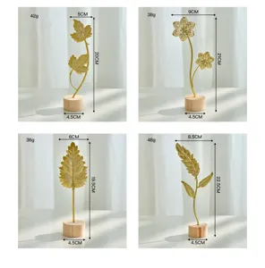 Elegant Nordic golden metal leaf ornaments with wooden base dimensions and weights