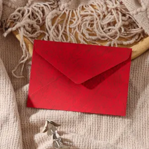 Red textured envelope for vintage retro handwritten letters, premium stationery detail view.