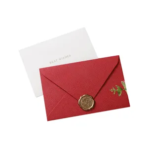 Ensemble de cartes de voeux et d'enveloppes texturees rouges avec sceau en cire.
