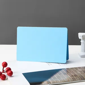 Blue blank folded greeting card detail shot, simple note card for hand-painted graffiti design.